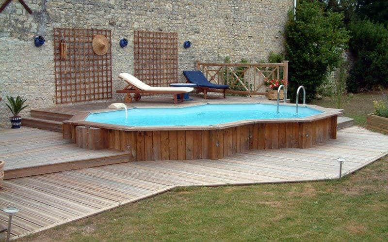 Small Above Ground Pool With Wooden Deck And Lounge