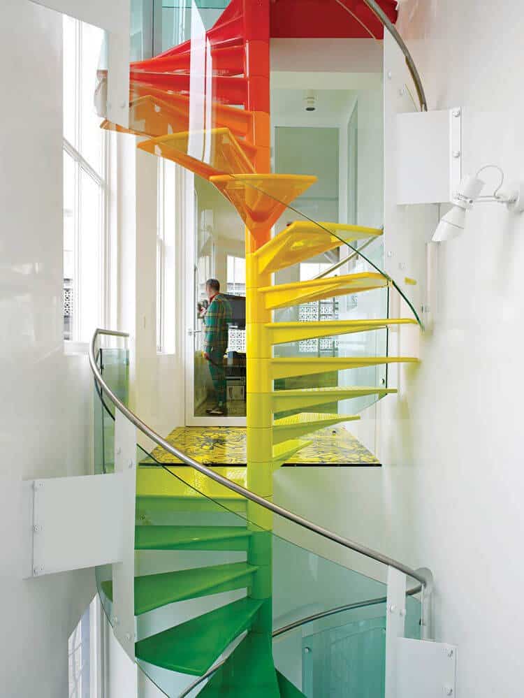 a multi-colored spiral staircase for anyone that loves colors