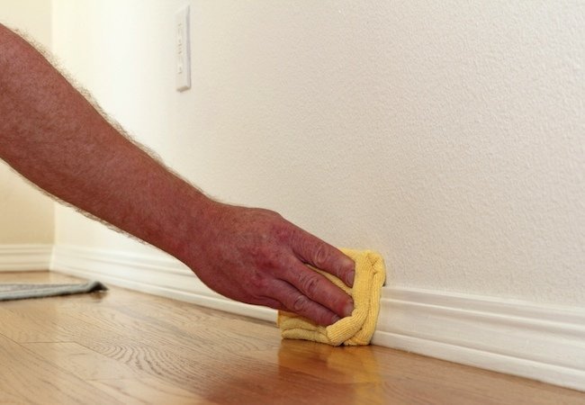 Cleaning Baseboard From Dirt By Bob Vila