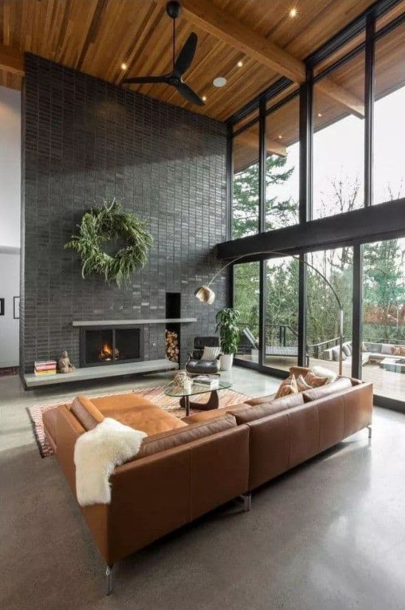 Modern Fireplace On High Ceiling Living Room With Floor To Ceiling Windows