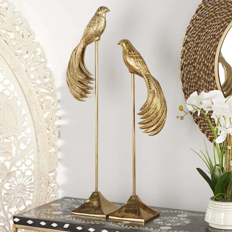 Add In Some Golden Bird Statues To Accent Your Room
