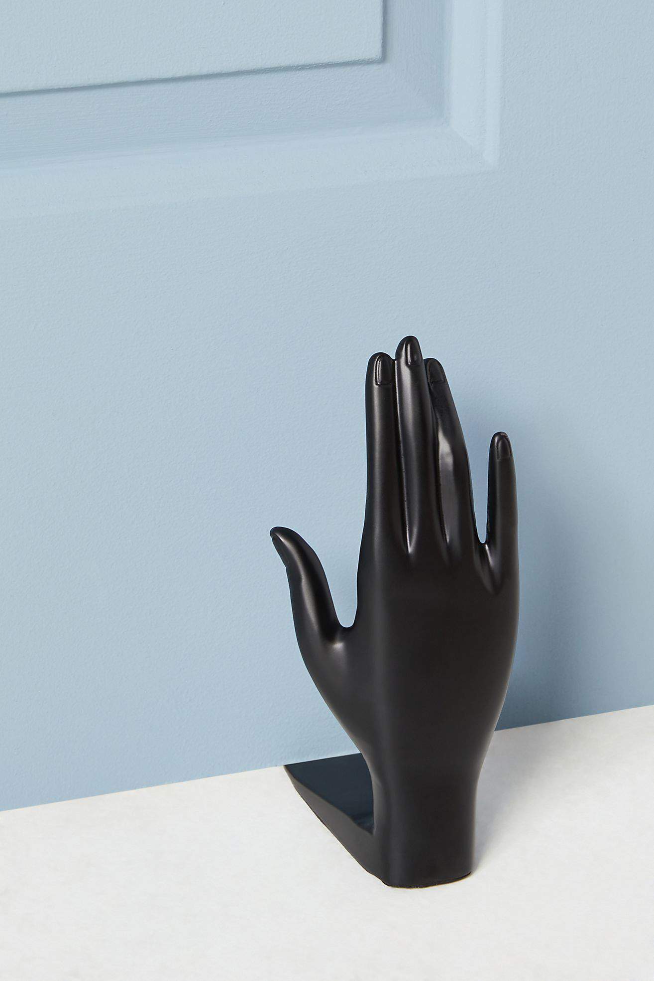 Any Bathroom Could Use A Chic Hand-Shaped Door Stopper