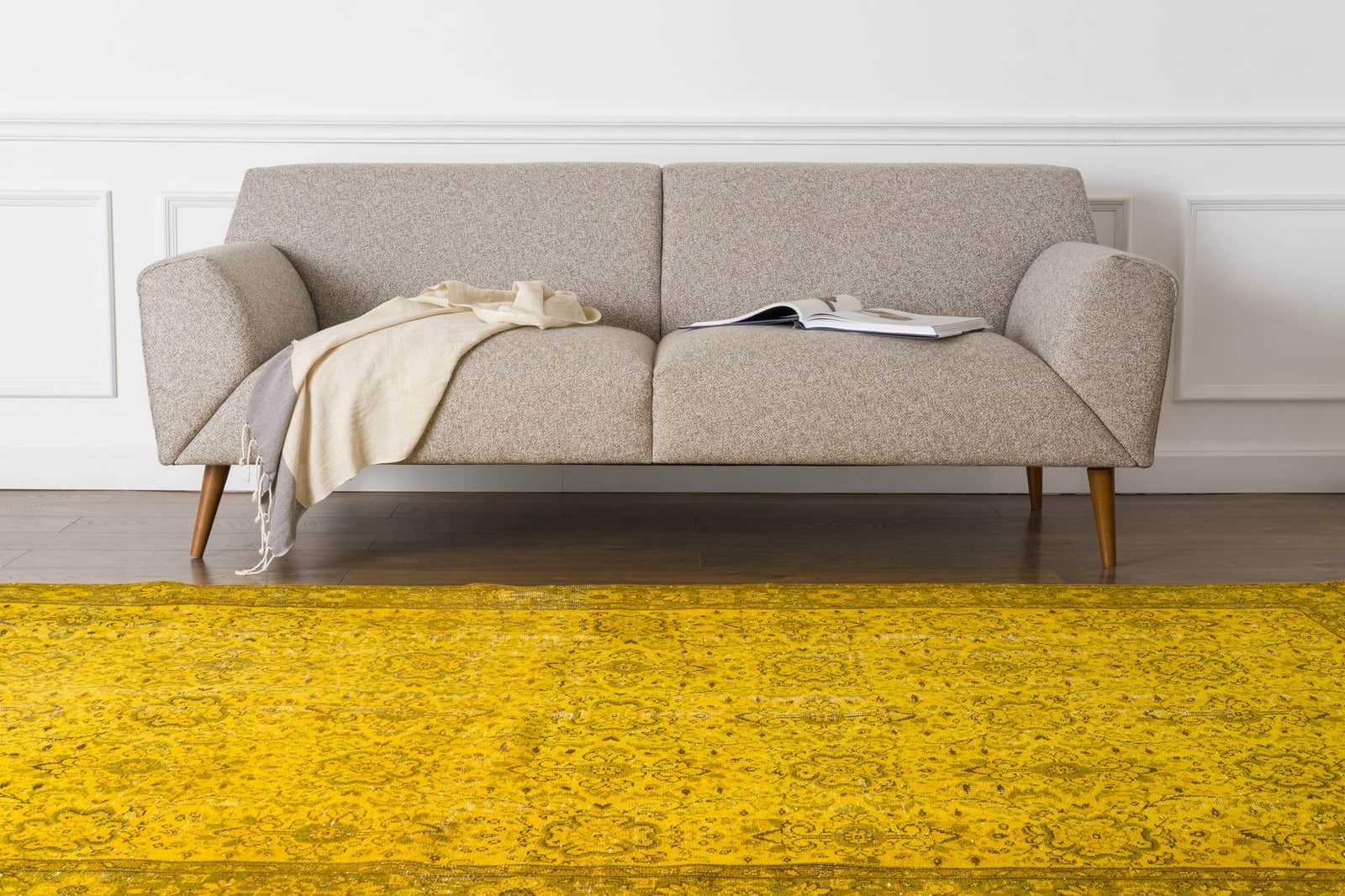 Choose A Yellow Rug For A Pop Of Color Against Grey Floors