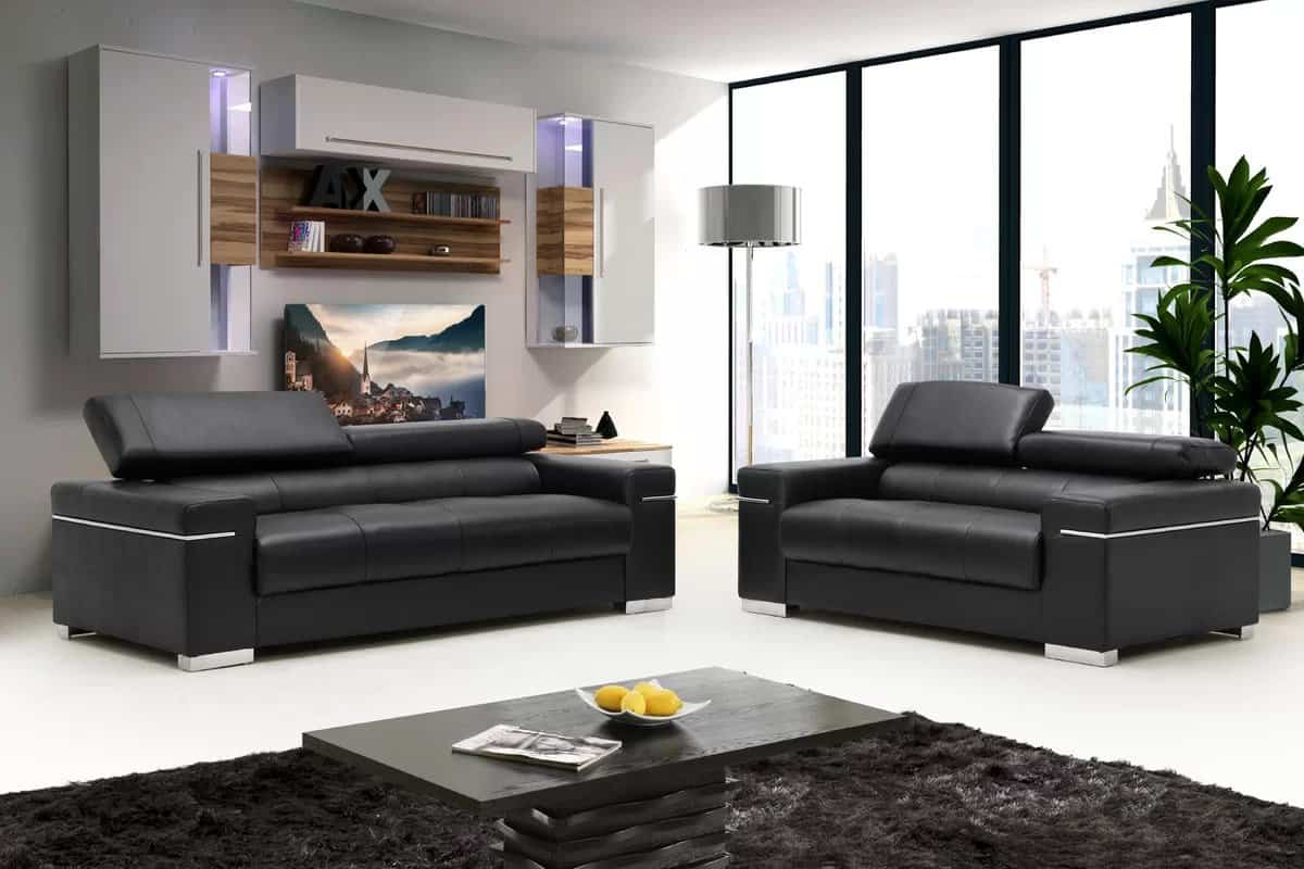 Black Leather Couches And White Shelving Make A Stunning Combination