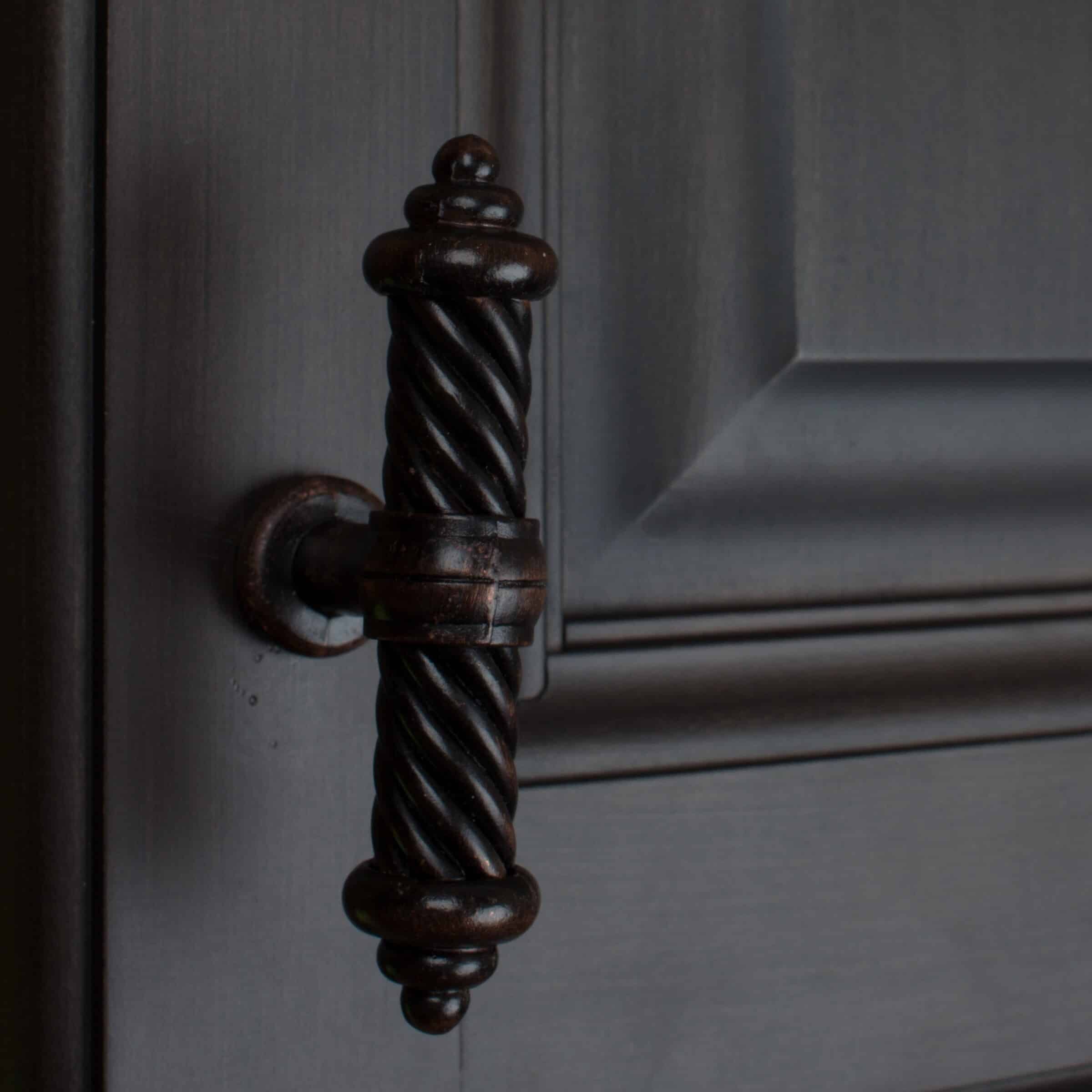 Traditional Iron Pulls Are A Stunning Choice For Dark Gray Cabinets